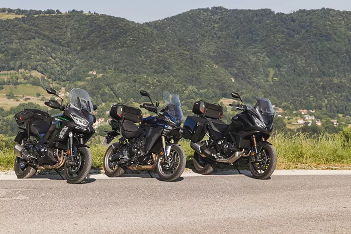 Three Touring Concepts, One Goal: Top-Level Comfort, Dynamics, and Everyday Usability. In Slovenia's twisty wonderland, the NT1100, Versys 1100 SE, and Tracer 9GT+ go head-to-head.