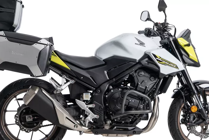Für die Honda CB 500 Hornet mit E-Clutch bietet Hepco & Becker einen aktualisierten Motorschutzbügel an. Das Zubehör soll Schutz bieten und sich fahrzeugspezifisch montieren lassen.
