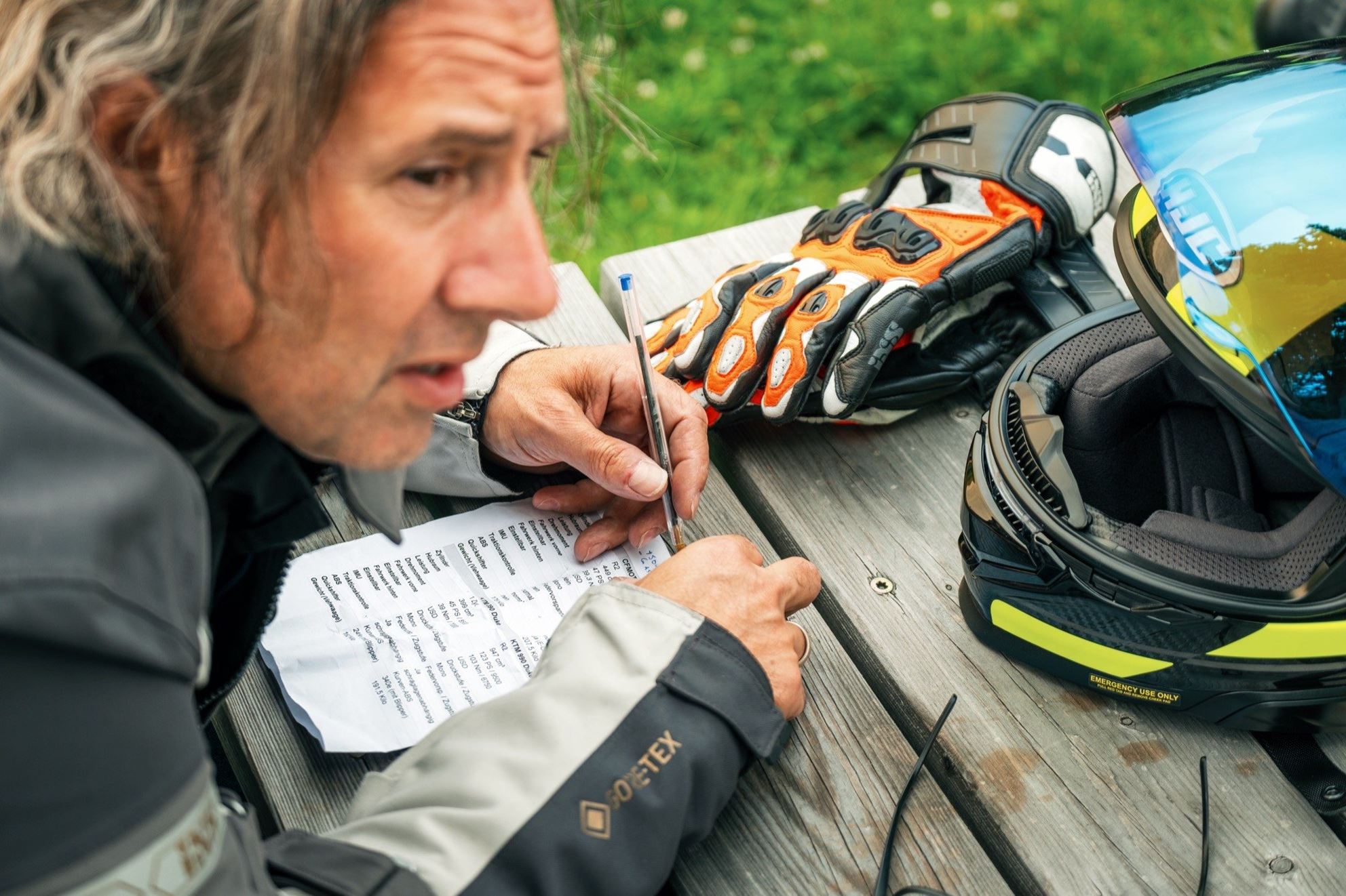 'Colleague Vauli doing his homework! Technical data is being studied, evaluation sheets are being filled out!'