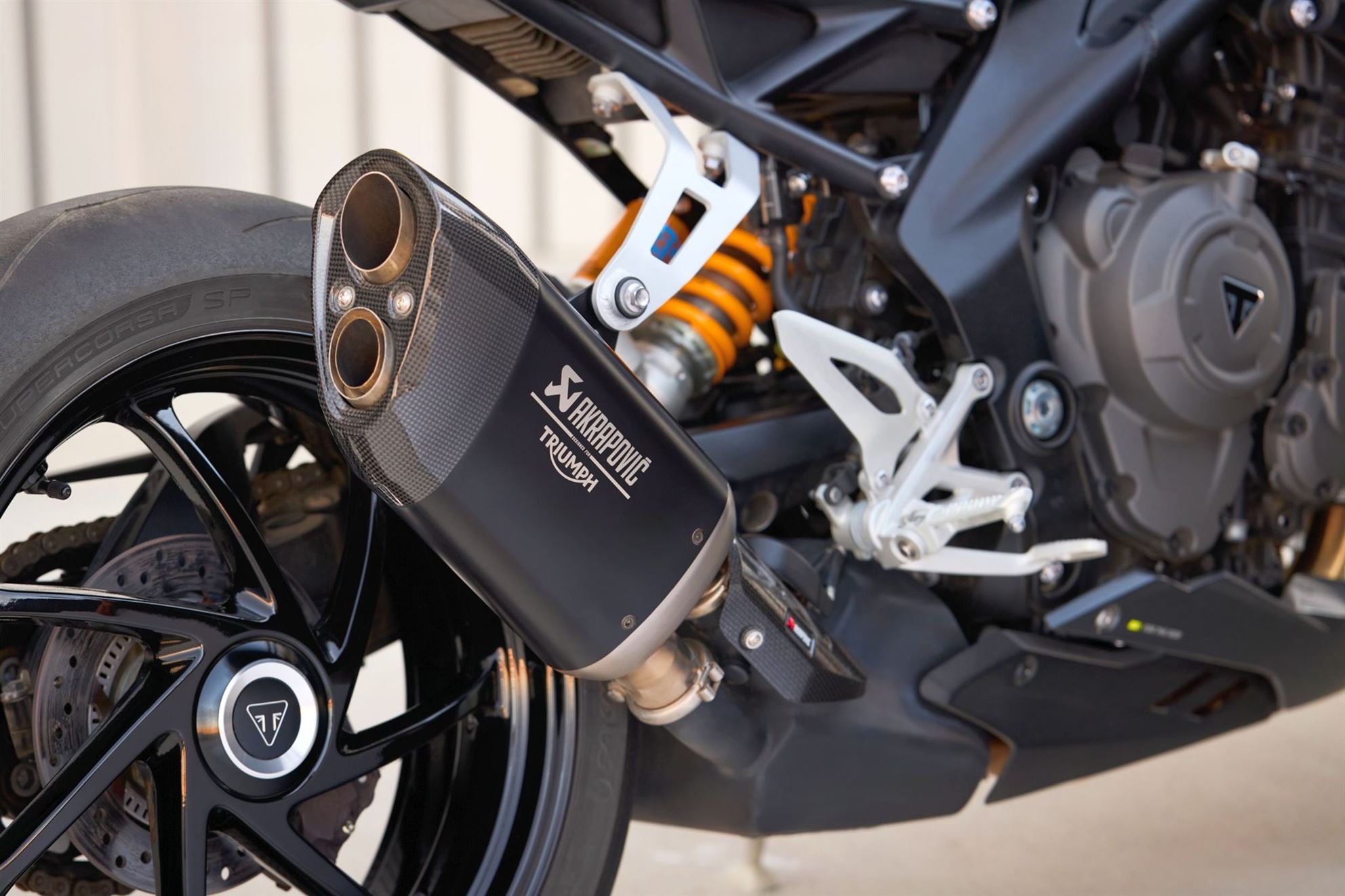 The optional Akrapovic slip-on for the Speed Triple 1200 RS 2025.