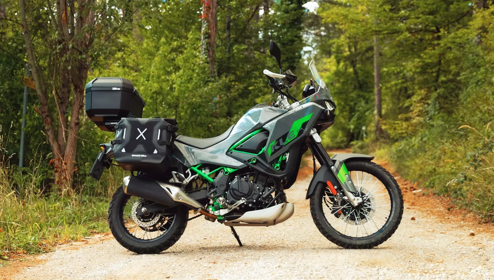 2026 Kawasaki KLE 500 SE with SHAD top case and side bags on a gravel track
