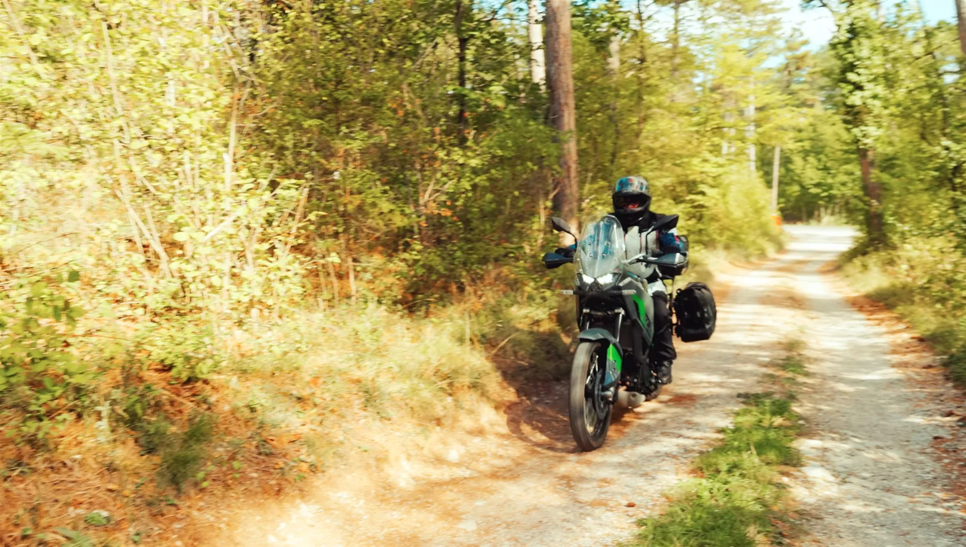 Kawasaki KLE 500 on a gravel track against the light