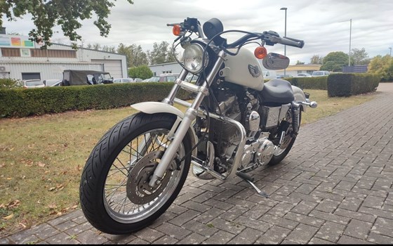 Gebrauchtmotorrad Harley-Davidson Sportster XL 883 Hugger - Bild 4