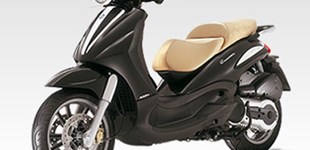 Honda ADV350 2025 vs Piaggio Beverly 500 Cruiser 2011