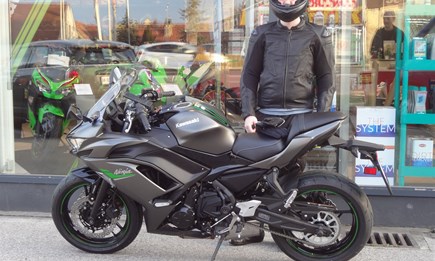 Happiness is a motorcycle, a full tank of gas and green lights.  