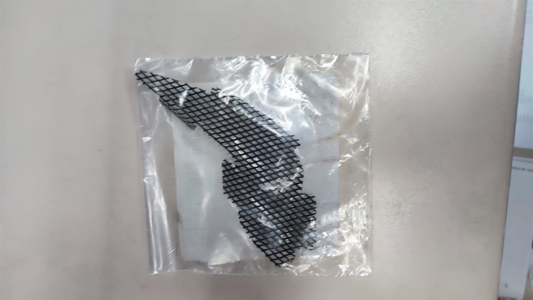 Verkleidungsgitter hinten links 