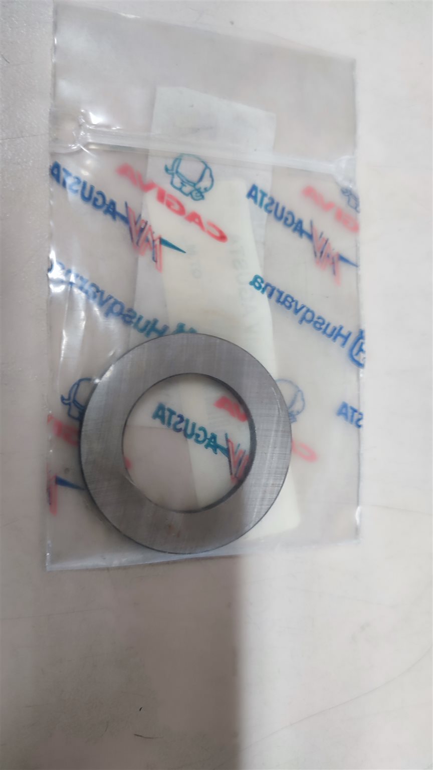 Unterlegscheibe zwischen Ritzel und Mutter